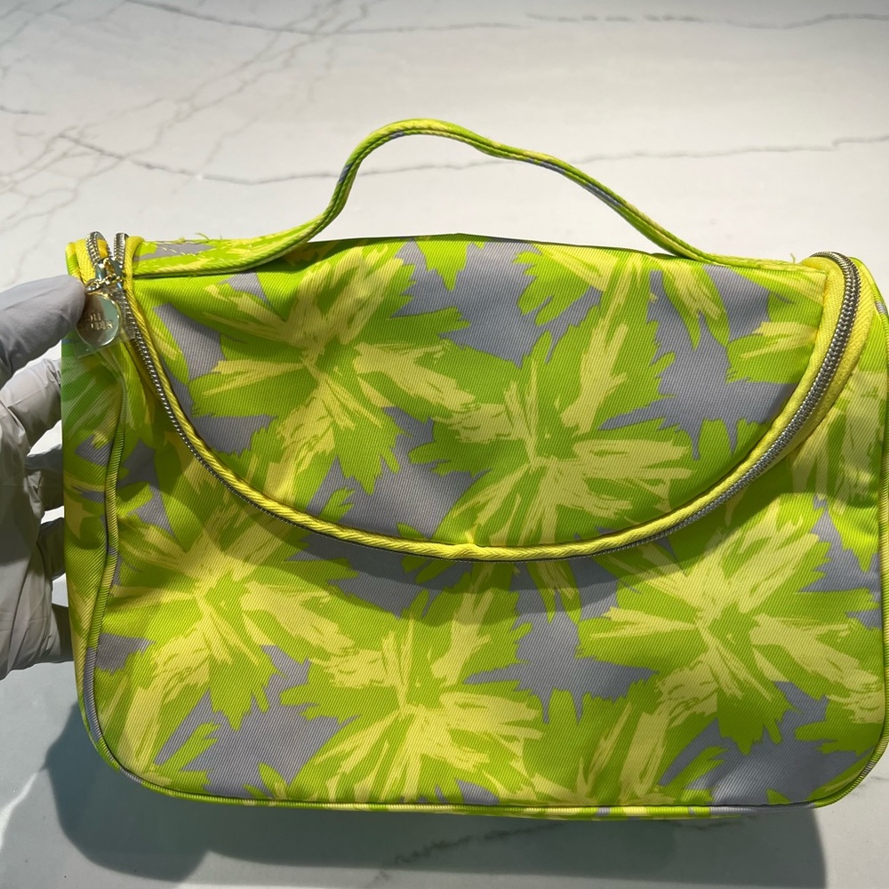 New Estée Lauder Makeup Bag with travel size samples and bottle.